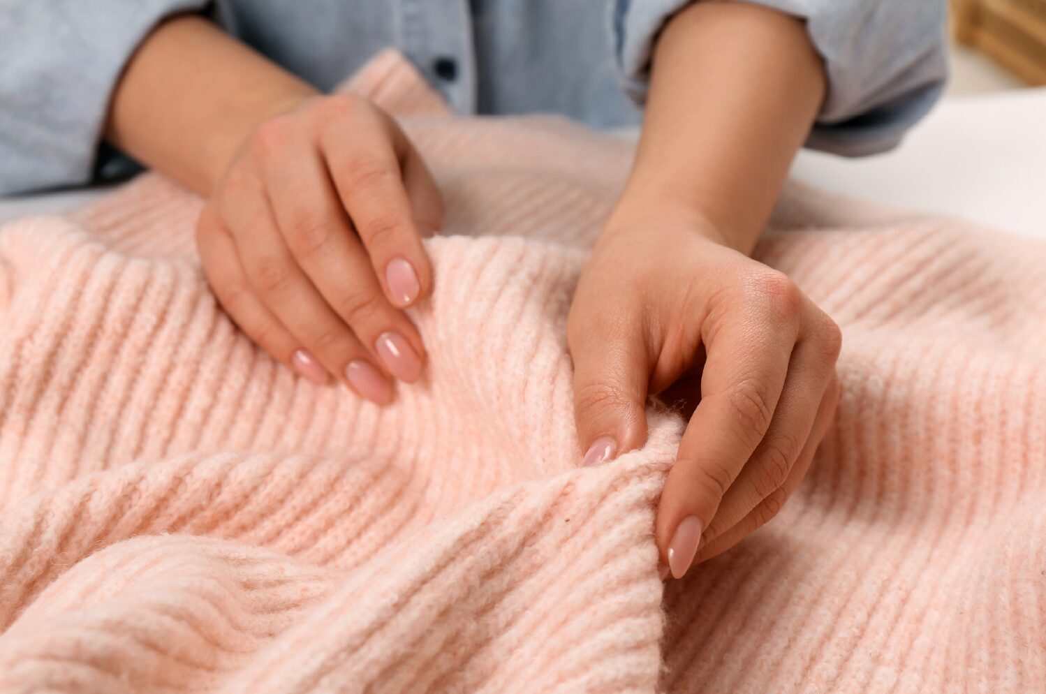 Woman wrapped in a Cozy Earth blanket, representing the comfort-focused brand featured in a Zeta case study on newsletter ad performance.
